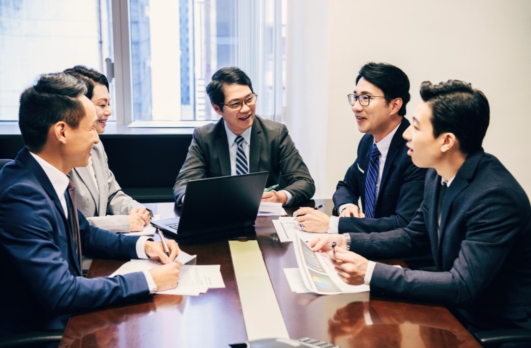 a group of chinese men having a meeting